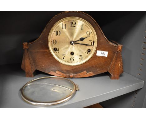 A 1930s hump back mantel clock, AF.