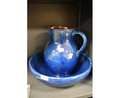An earthenware jug and basin set, having blue and brown glaze, AF.