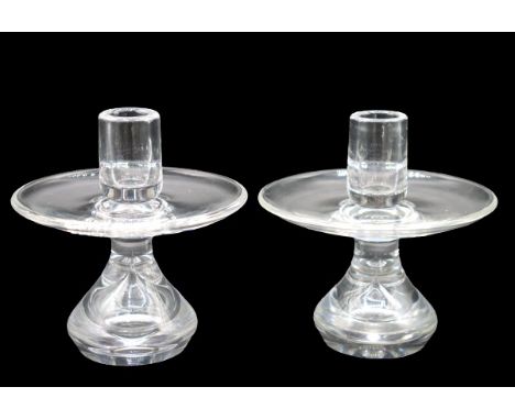 Pair of Steuben glass candle holders, signed on the base. Size of each: 6 x 5 in. Please note that all sales are final. No re