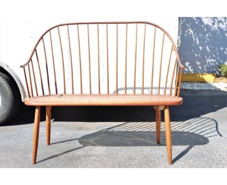 Thomas Moser "Continuous Arm Bench" Shaker Bench with spindle back. Signed and dated 1977 underneath. Damaged areas can bee s