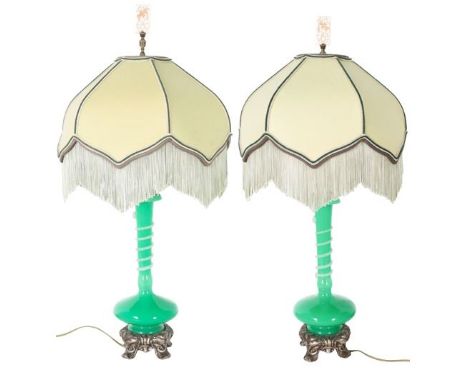 Pair of Steuben green jade and alabaster lamps on patinated mount. Size: 14 x 14 x 27 in. Please note that all sales are fina