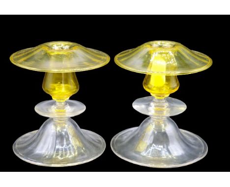 Pair of Steuben Candlesticks in mushroom form with amber and clear glass. Size: 5 x 5 in. Please note that all sales are fina