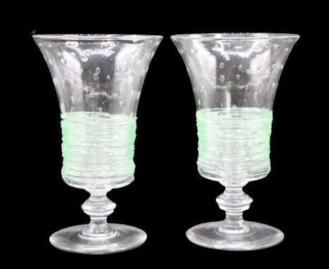 Two lovely Steuben controlled bubble wine glasses with green threading. Size of each: 6 1/2 x 4 in. Please note that all sale