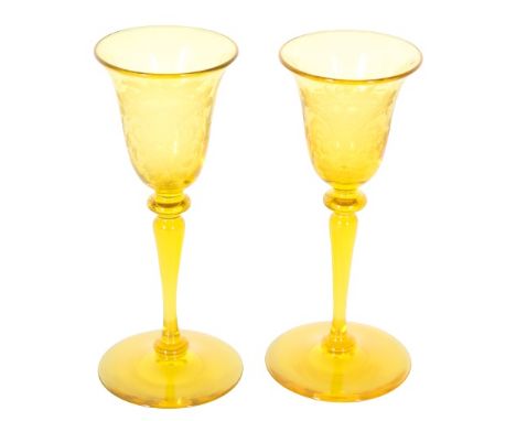 Beautiful pair of Steuben Bristol yellow wine goblets with a intricate motif design. Size: 6 x 2 3/4 in. Please note that all