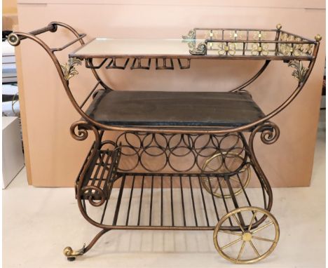 In the manner of Maitland Smith bar cart with attention to detail, a reticulated gallery and faux marble shelf.Size: 40 x 21 