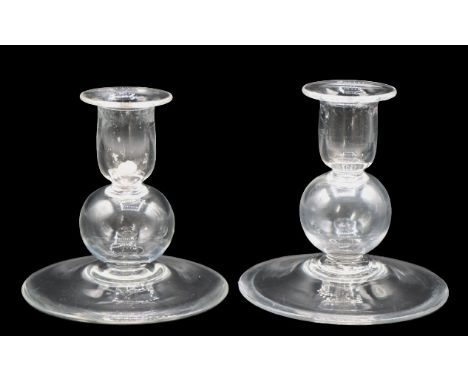 Pair of Steuben candlestick holders. Signed on the underside. Size: 4 1/2 x 4 1/2 in. Please note that all sales are final. N