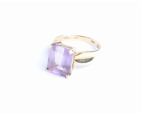 A continental amethyst single stone ring, the rectangular cut-corner step-cut stone approx 4.90 ct, in a four-claw setting be