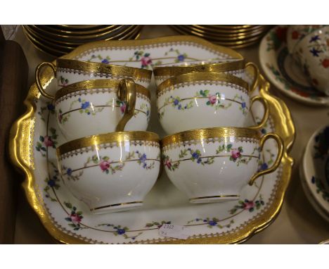 A Minton's part tea service with floral bands and gilt border with other tea and coffee wares