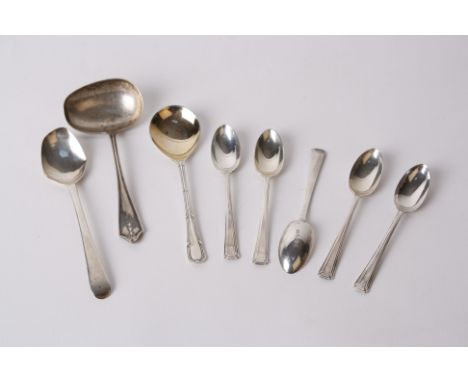 Silver teaspoons and a ladle 
