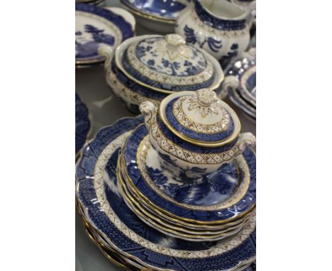 A Booths 'Real Old Willow' pattern dinner service together with a matching part tea service (qty)