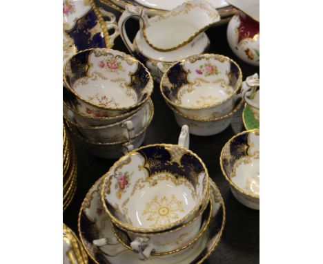 A Coalport porcelain blue and gilt decorated part tea service and two other part tea services (qty)