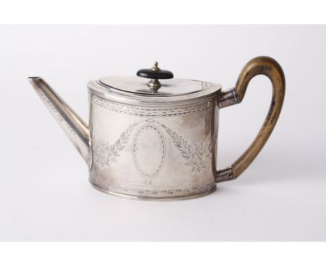 A 19th century Duth oval small teapot, the straight sides engraved with leaves and oval cartouche, Amsterdam 1854, makers mar