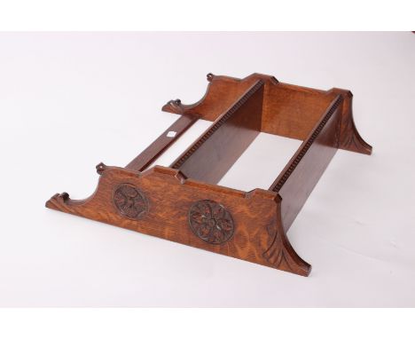 An Arts and Crafts oak hanging wall shelf, 48cm