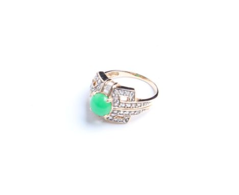 A jadeite and paste dress ring, the round  carbonated jade with a pierced geometric surround set with near-colourless stones,