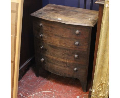 A 19th Century mahogany commode in the form of a bowfront chest 