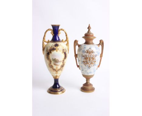 A Royal Worcester two handled urn and cover with gilt floral moulded decoration applied on a mottled blue ground, shape no. 1