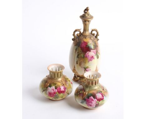 A Royal Worcester porcelain twin handled ovoid vase and cover, decorated with roses with a floral lid (chipped), h: 26.5cm, w