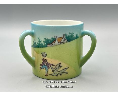 A small childrens three handled lithophane cup showing a portrait of Queen Alexandra at the base, decorated with a rural scen