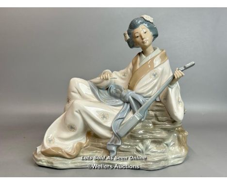 A large NAO Geisha figure playing a Shamisen,  26cm high, 39cm wide / T37