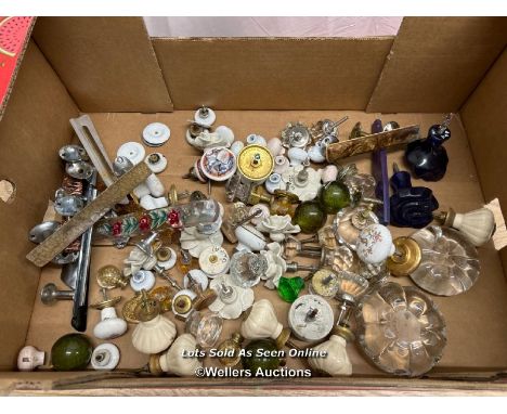 Large quantity of assorted glass, ceramic, and plastic doorknobs and handles