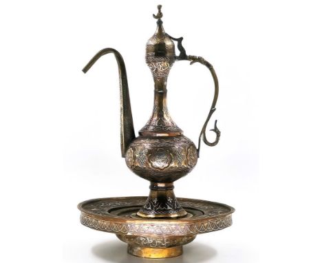 Islamic Aftaba with matching basin and strainer, decorated with Damascus work (inlay of copper and silver in brass), Height i