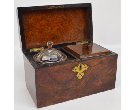 A Victorian figured walnut tea caddy, the hinged lid enclosing interior lidded compartment and glass bowl with cover, width 2