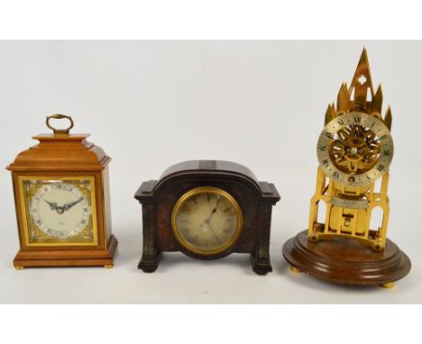 ELLIOT OF LONDON; a 20th century brass Gothic style skeleton clock with fusee movement, the circular chapter ring set with Ro