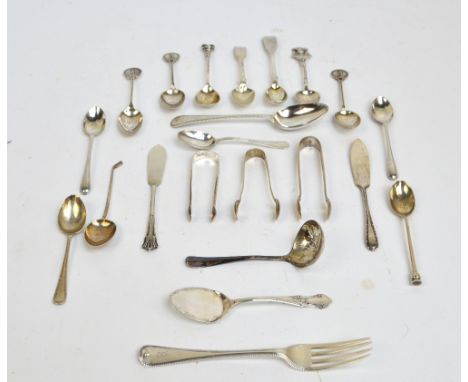 A collection of small hallmarked silver flatware items comprising a Victorian bright cut beaded dessert spoon, Sheffield 1868