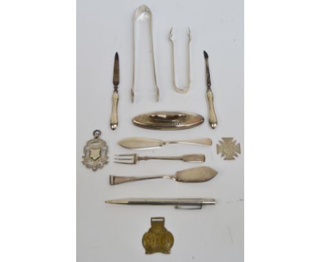 A small group of variously hallmarked silver items including a pair of George III hallmarked silver sugar tongs, Stephen Adam