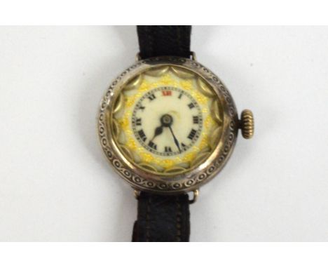 An early 20th century Continental silver wristwatch, the circular enamel dial set with Roman numerals, diameter excluding win