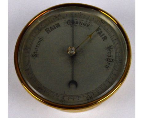 An early 20th century brass cased barometer with silvered dial, diameter 13.5cm.