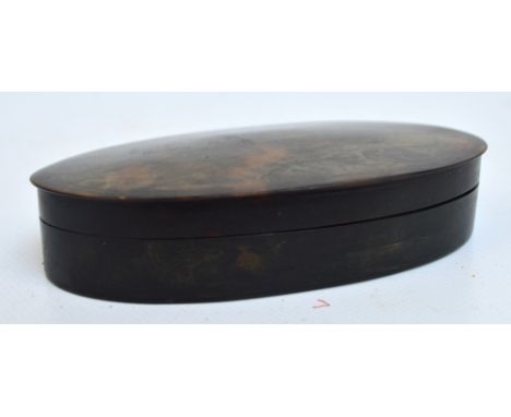 A 19th century tortoiseshell snuff box of plain oval form with detachable lid, 12 x 7 x 2.5cm.