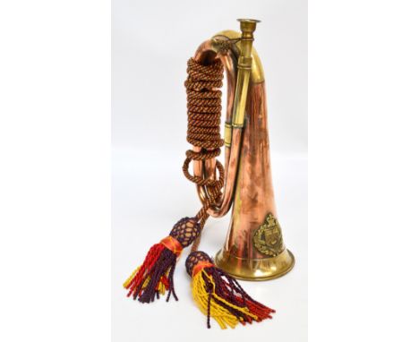 A late 19th/early 20th century military copper and brass bugle with an applied Western Australian University regiment coat of