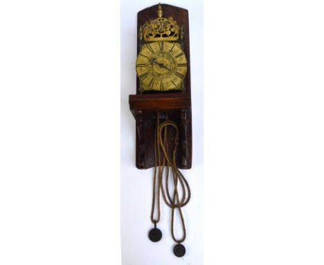 A 19th century brass lantern clock, in the 17th century style, with pierced pediment and circular dial set with Roman numeral