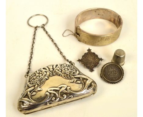 An Edward VII hallmarked silver Art Nouveau purse decorated with stylised scrolls and flowers suspended by two chains from a 