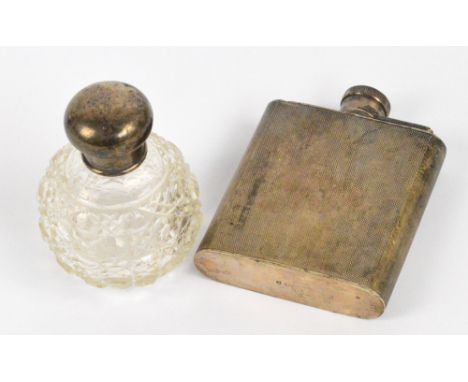 A George VI hallmarked silver hip flask with machine turned decoration and integral hinged screw stopper, Charles S. Green & 