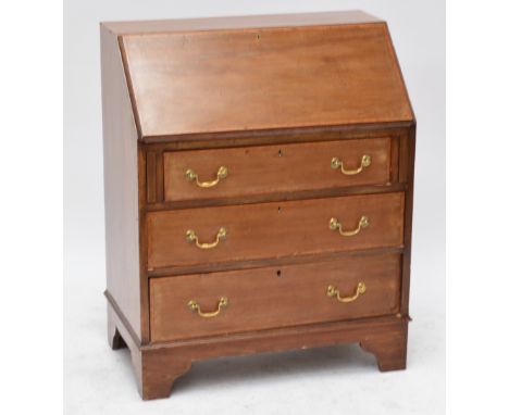 An Edwardian mahogany and satinwood crossbanded bureau with three graduated drawers raised on bracket feet, width 77cm.