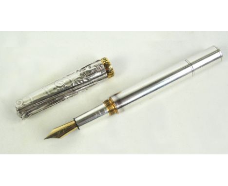 A limited edition Michel Audiard silver plated fountain pen for Charles Heidsieck, the top of crumpled form, signed and dated