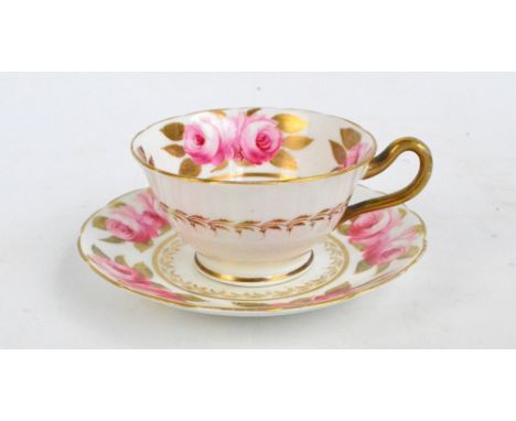 A 19th century Swansea pink rose decorated gilt heightened cup and saucer, marked to base of saucer, diameter of saucer 14cm,
