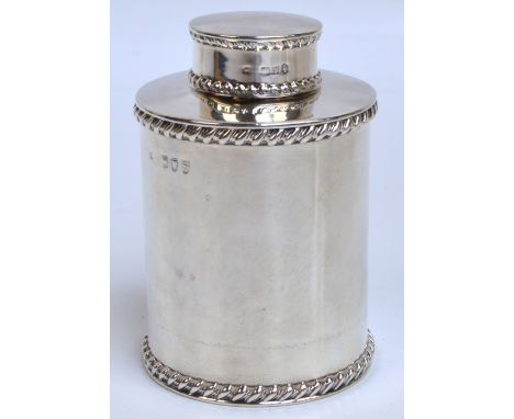 A late Victorian hallmarked silver tea caddy of circular form with two bands of wrythen moulded decoration and plain body, Wi