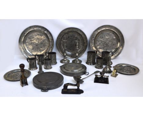 A quantity of predominantly 19th century pewter including large chargers, mugs, wine funnel, ladle, etc, also a stamp, small 