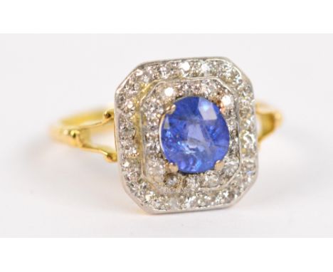 An 18ct yellow gold sapphire and diamond ring, the central circular sapphire weighing approx 0.8cts set within a stepped bord