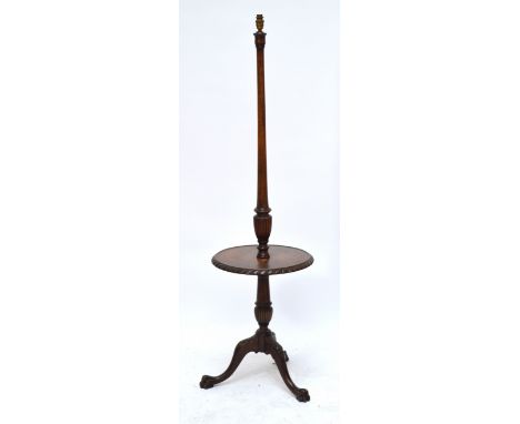 A 1930s mahogany standard lamp with dished platfrom.