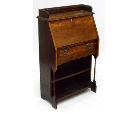 An early 20th century oak student's bureau with fall front, single drawer and shelf below, width 70cm.
