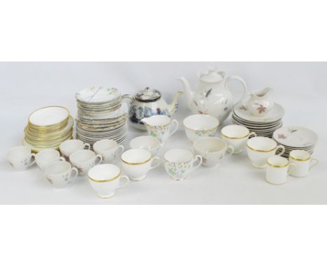 A Royal Doulton "Tumbling Leaves" pattern decorated coffee and tea set comprising a teapot, coffee and tea cups with saucers,