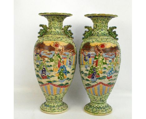 A pair of 20th century Japanese crackle glazed ceramic vases of baluster form with flared lobed rims and twin handles, painte