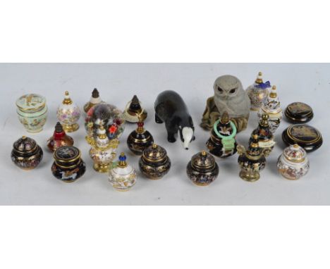 A quantity of decorative Greek "Venus" and other small solid perfume scent bottles of various shapes and sizes, decorated wit