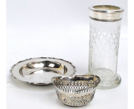 A George V hallmarked silver shaped circular dish with cast decorated rim, William Hutton & Sons Ltd, Sheffield 1910, diamete