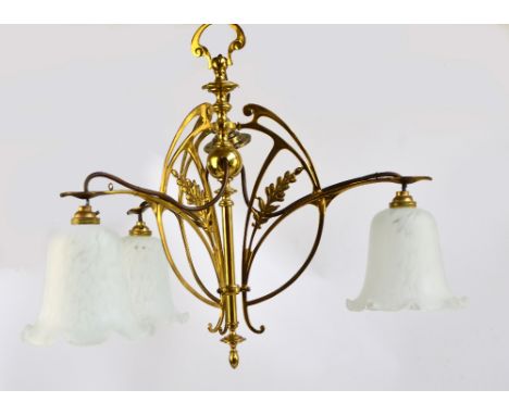 A 20th century brass three branch pendant light fitting of pierced form decorated with sprigs of berries, with shaped upper l
