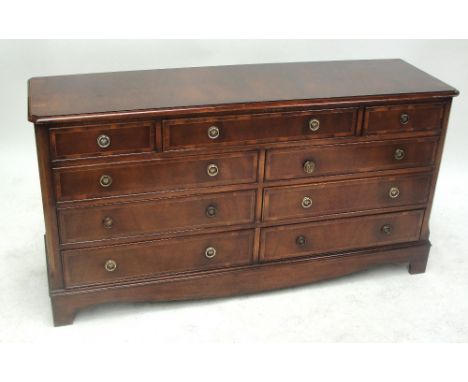 A reproduction mahogany nine-drawer sideboard raised on bracket feet, width 146cm.